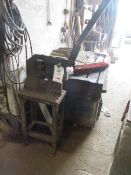 Un-named manual operated shear mounted on stand