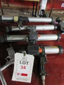 Four various pneumatic grease guns, one pistol air line