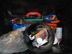 Box of tools including saws, trowels, floats and drill bits