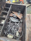 Wooden box of skates and lashing cable