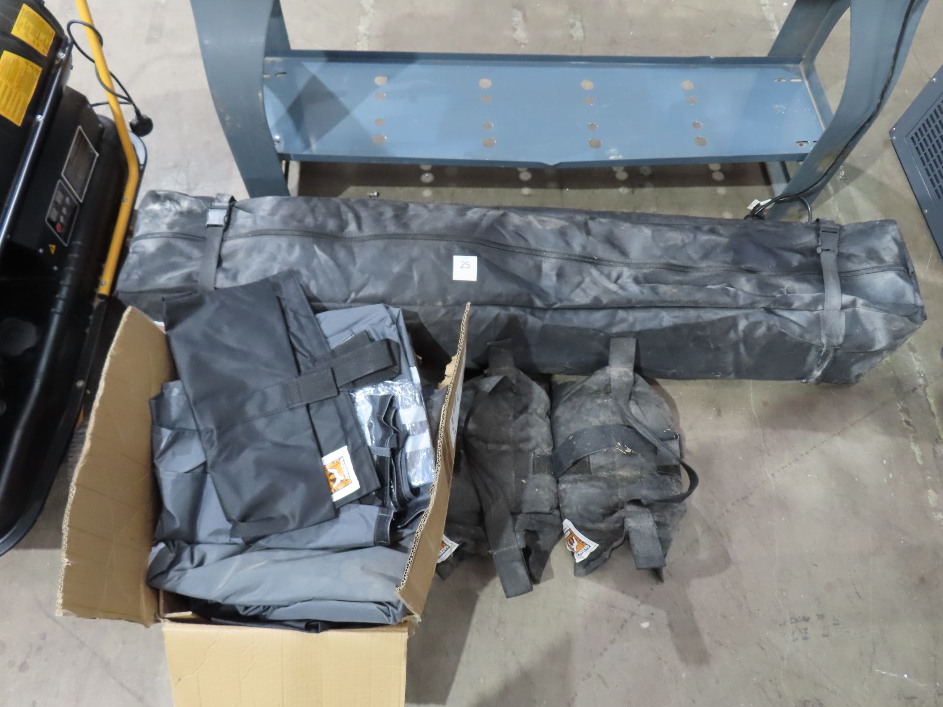Gorilla gazebo with sandbags, sheets etc