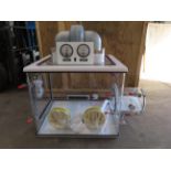 An Anerobic Chamber/Sealed Isolation Glove Box with airlock transfer chamber, dual pressure gauges,