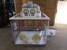 An Anerobic Chamber/Sealed Isolation Glove Box with airlock transfer chamber, dual pressure gauges,