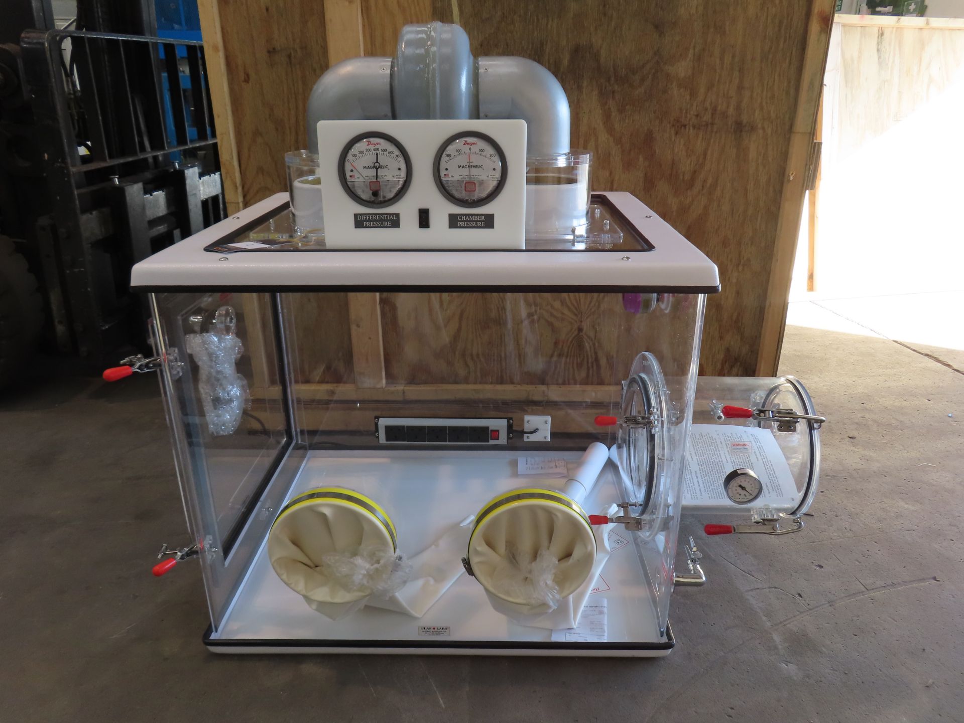 An Anerobic Chamber/Sealed Isolation Glove Box with airlock transfer chamber, dual pressure gauges,