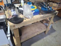 Wooden workbench with quantity of coffee machine spares