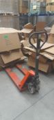 Unbadged pallet truck 2000kg capacity . Located on ground floor