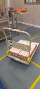 Unbadged flat bed trolley. Located on first floor, access by goods lift and stairs