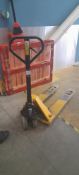 Unbadged pallet truck. Located on ground floor