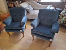 Pair of blue velvet armchairs with Queen Ann wooden legs, piping and button backs