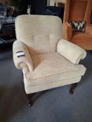 Upholstered armchair with Queen Ann legs