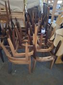 Approximately 30 wooden chair frame bases in various varnish stain and laminate curved back