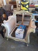 Ornate wooden framed chair in antique silver