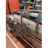 Inline Full Bottle conveyors. Conveyors from Filling to Trolley Packers with Heuft Lane Bottle diver
