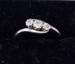 A Gold and Platinum Three-Stone Diamond Ring the graduated old-cut diamonds claw-set within
