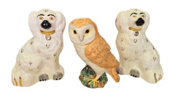 A Pair of Beswick Dogs and a Beswick Owl A pair of Beswick ceramic seated dog figures, each modelled