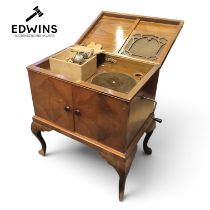 A Vintage Super Royale cabinet gramophone, hand-crank handle and a wood veneer stand.Design
