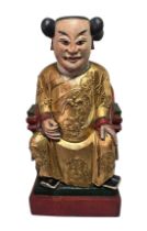 Chinese carved and polychrome painted seated figure of an official. Modelled seated on a high-backed