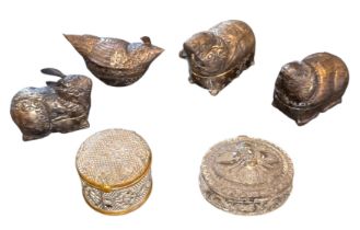 A collection of six Southeast Asian, likely Cambodian or Khmer, silvered repoussé metal betel-nut or