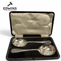 A Pair of Cased Silver Plated Art Deco Serving Spoons.