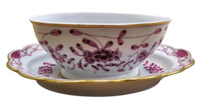 A Meissen porcelain oval sauce tureen with integral stand, decorated in puce floral sprigs and