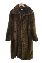 Ladies' Dasco Leopard Print Faux Fur Coat with Shawl Collar, together with a faux fur trapper/