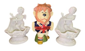 A 1966 World Cup Willie Ceramic Money Box and Pair of Lenwile Ardalt Artware Cherub Dishes. The 1966