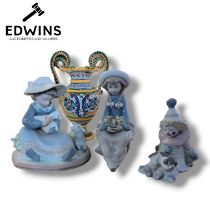 Three Lladro figures to include "Lambkins", "Pierrot with puppy", and "Pretty and Prim"; alongside