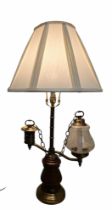 A Vintage Double-Arm Student Lamp, with turned wooden and brass-mounted base, central column and two