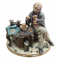 Luciano Cazzola for Porcellane Principe Capodimonte porcelain figure of a jeweller, finely