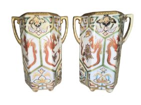 A pair of Art Deco Japanese Noritake porcelain twin-handled vases, of hexagonal form, decorated with