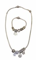 A Pandora silver snake chain necklace and bracelet set with fourteen charms, Including a Spiritual