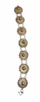 A vintage Siam Silver Filigree Panel Bracelet, Formed from seven linked circular panels with