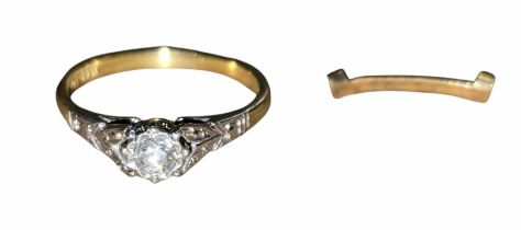 An 18ct yellow gold ring with a round brilliant-cut diamond solitaire in a platinum setting, the