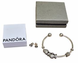 A Pandora silver bangle with five charms and a pair of Pandora earrings, boxed The bangle set with