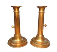 A pair of 19th century brass push-up candlesticks, 19cm high, c.1860