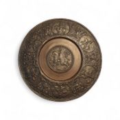 A bronze Heemskirk type circular dish, cast in relief with medieval horsemen, 18.5cm diam