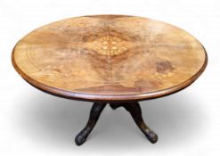 A Victorian walnut and marquetry centre table, inlaid oval quarter-veneered tilting top, quad-