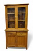 An oak side cabinet/dresser, two glazed doors the interior with adjustable shelf, the projecting