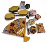 A Stratton compact, the cover with pansies, 7.5cm diam;  another;    a gilt metal and yellow