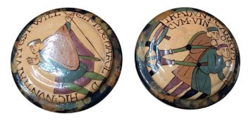 A pair of 'Bayeux Tapestry' compressed circular pots and covers, the covers with stylised figures,