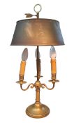 A 19th century brass three light side light, scroll arms, toleware shade, 57cm high