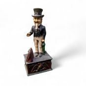 American Interest - a reproduction cast iron novelty money box or bank, as Uncle Sam dispensing