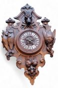 A German Black Forest wall clock, 22cm dial applied with Roman numerals, striking on a gong, the