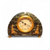 A French serpentine clock, 4.5cm diam, Arabic numerals, arched case applied with gilt foliage,