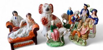 A Staffordshire dog seated to the left, rust coat markings, c.1880;  a  pair of Staffordshire