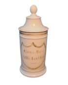 A French white ceramic pharmaceutical jar and cover, ball finial, inscribed in gilt, 16.5cm high,