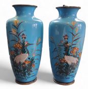 A pair of Chinese cloisonne ovoid vases, enamelled with storks and flowers and foliage on a