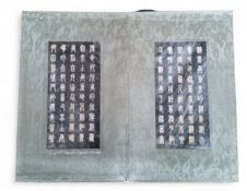 A Chinese Qianlong-style hardstone book, with  fourteen stone panels incised with calligraphy and