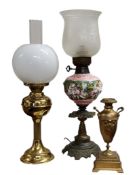 A Capo-di-monte and gilt metal oil lamp the globular resevoir in relief with cherubs, frosted shade,