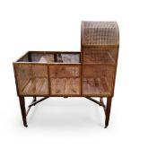 A 19th century mahogany and bergere cot,  arched canopy, 114cm high, 100cm long, 51cm wide, c.1870